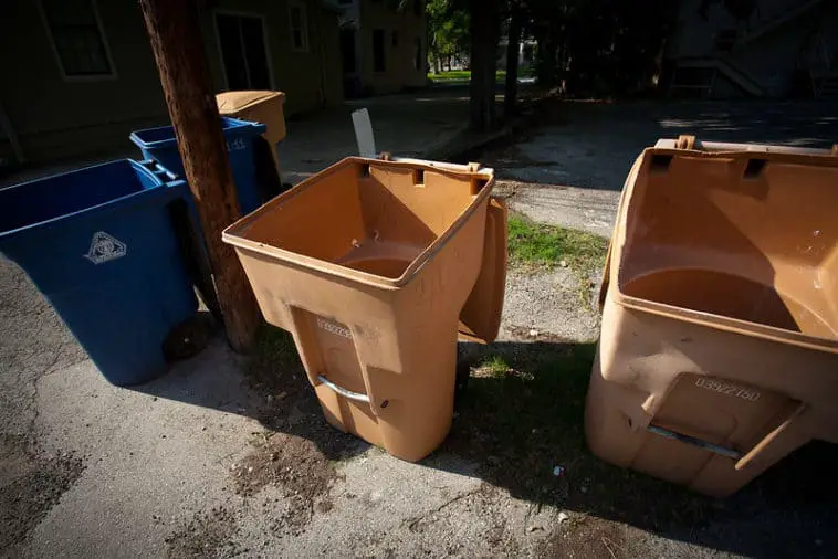 Can Your Neighbor Put Their Trash Cans In Front Of Your House? (Yes And